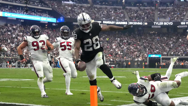 Oct 23, 2022; Paradise, Nevada, USA; Las Vegas Raiders running back Josh Jacobs (28) scores on a 7-yard touchdown run in the third quarter against the Houston Texans at Allegiant Stadium. Mandatory Credit: Kirby Lee-USA TODAY Sports